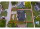 Aerial view of house and lawn surrounded by a fence in a residential neighborhood at 146 Hidden Pointe Ln, Groveland, FL 34736