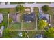 An aerial view showcases the home and its surrounding neighborhood at 146 Hidden Pointe Ln, Groveland, FL 34736