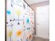 Bathroom with colorful shower curtain and white door at 146 Hidden Pointe Ln, Groveland, FL 34736