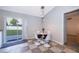Cozy dining area with modern lighting and patio access at 146 Hidden Pointe Ln, Groveland, FL 34736