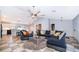 Spacious living room with ceiling fan and easy access to kitchen and dining at 146 Hidden Pointe Ln, Groveland, FL 34736
