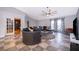 Inviting living room with ample seating, ceiling fan, and stylish decor at 146 Hidden Pointe Ln, Groveland, FL 34736