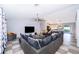 Comfortable living room with plush seating, large TV, and open layout at 146 Hidden Pointe Ln, Groveland, FL 34736