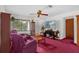 Bright and airy living room with large window, ceiling fan, and comfortable seating at 1588 Alloway Dr, Deltona, FL 32738
