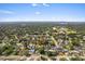 Aerial view of property in a neighborhood with mature trees and landscape at 2020 Geronimo Trl, Maitland, FL 32751