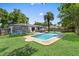 Relaxing backyard featuring a pristine pool, lounging area, trampoline and well-kept lawn at 2020 Geronimo Trl, Maitland, FL 32751