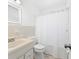 Clean bathroom featuring a shower, a sink, and a toilet at 2020 Geronimo Trl, Maitland, FL 32751