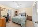 Cozy bedroom with a ceiling fan, a bed, and a bookshelf at 2020 Geronimo Trl, Maitland, FL 32751