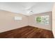 Modern bedroom with wood floors, a ceiling fan, and natural light from windows at 2020 Geronimo Trl, Maitland, FL 32751