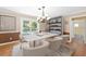 Bright dining area with modern table and chairs, chandelier, and sliding doors to the swimming pool at 2020 Geronimo Trl, Maitland, FL 32751