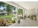 Inviting front porch featuring a decorative bench and an array of potted plants, offering a tranquil outdoor space at 2020 Geronimo Trl, Maitland, FL 32751