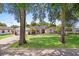 Attractive single-story home featuring a well-manicured front lawn framed by mature trees and landscaping at 2020 Geronimo Trl, Maitland, FL 32751
