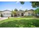 Charming single-story home with a well-manicured lawn, beautiful landscaping, and a welcoming front entrance at 2020 Geronimo Trl, Maitland, FL 32751