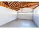Bright garage with exposed wooden beams and new floor at 2020 Geronimo Trl, Maitland, FL 32751