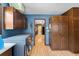 Laundry room featuring modern appliances and convenient storage cabinets at 2020 Geronimo Trl, Maitland, FL 32751