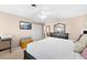 Comfortable main bedroom featuring neutral tones, a ceiling fan, and TV at 2020 Geronimo Trl, Maitland, FL 32751