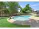 Outdoor pool surrounded by a patio and green grass at 2020 Geronimo Trl, Maitland, FL 32751