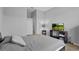 Comfortable bedroom featuring a large bed and a wall-mounted TV for entertainment at 2171 Timber Creek Ln, Clermont, FL 34715