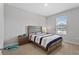 Neutral bedroom with a blue and gray bedspread, carpeted floors, and window with blinds for a serene space at 2171 Timber Creek Ln, Clermont, FL 34715