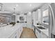 Bright kitchen featuring an island with seating, stainless steel appliances, and sleek countertops at 2171 Timber Creek Ln, Clermont, FL 34715