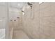 Elegant tiled shower with dual shower heads and built-in niche for toiletries at 2171 Timber Creek Ln, Clermont, FL 34715