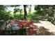 Peaceful backyard with a rustic patio, mulch accents, and scenic views of the lake at 238 Lake Dr, Orlando, FL 32835