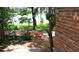 Inviting backyard featuring a brick patio and a tranquil view of the lake at 238 Lake Dr, Orlando, FL 32835