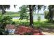 Backyard featuring a brick patio, seating, and peaceful lake views, offering a serene outdoor space at 238 Lake Dr, Orlando, FL 32835
