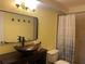 Bathroom featuring a vessel sink, unique mirror, and bright wainscotting at 238 Lake Dr, Orlando, FL 32835
