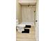 Bathroom featuring a toilet, black bath mats, and a tiled shower with a black shower head at 238 Lake Dr, Orlando, FL 32835