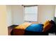 Cozy bedroom featuring a bright window and contemporary decor at 238 Lake Dr, Orlando, FL 32835