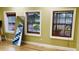 Bedroom with wooden floors, green walls, and three windows allowing plenty of natural light at 238 Lake Dr, Orlando, FL 32835