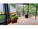 Relaxing deck with potted plants and a view of lush greenery at 238 Lake Dr, Orlando, FL 32835