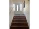 Stairway leads to an entryway door with decorative glass side panels at 238 Lake Dr, Orlando, FL 32835
