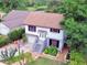 Charming home features a welcoming front yard with lush landscaping and a freshly painted exterior at 238 Lake Dr, Orlando, FL 32835