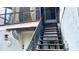 Exterior stairs with railing lead to a back entrance at 238 Lake Dr, Orlando, FL 32835
