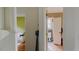 Hallway view with an open doorway to a bathroom and a glimpse of a living space enhancing functionality at 238 Lake Dr, Orlando, FL 32835
