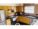 Well-equipped kitchen with stainless steel appliances, dark countertops, and unique backsplash, offering both style and functionality at 238 Lake Dr, Orlando, FL 32835