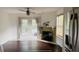 Bright living room with hardwood floors, French doors, and a cozy fireplace, creating a warm and inviting space at 238 Lake Dr, Orlando, FL 32835