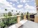 Balcony offers a green view of the neighborhood with palm trees and lush landscaping at 2520 Bella Vista Dr, Davenport, FL 33897
