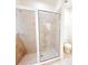 Bathroom featuring a tiled shower with glass enclosure, and standard toilet at 2520 Bella Vista Dr, Davenport, FL 33897