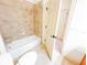 Bathroom with tub/shower and standard toilet, offering functionality and practicality at 2520 Bella Vista Dr, Davenport, FL 33897