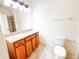 Bathroom with a granite countertop vanity and standard toilet at 2520 Bella Vista Dr, Davenport, FL 33897
