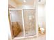 Bathroom featuring a tiled shower with glass enclosure and standard toilet at 2520 Bella Vista Dr, Davenport, FL 33897