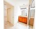 A bathroom with granite countertops, wooden cabinets, tile floors, and a glass shower at 2520 Bella Vista Dr, Davenport, FL 33897