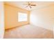 Bright, carpeted bedroom with a ceiling fan and a window at 2520 Bella Vista Dr, Davenport, FL 33897