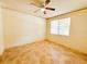 An empty bedroom features neutral walls, tile flooring, and a ceiling fan at 2520 Bella Vista Dr, Davenport, FL 33897