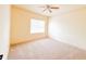 Carpeted bedroom with a ceiling fan and neutral paint, offering a comfortable and customizable space at 2520 Bella Vista Dr, Davenport, FL 33897