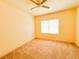 Carpeted bedroom with a ceiling fan and neutral paint, offering a comfortable and customizable space at 2520 Bella Vista Dr, Davenport, FL 33897