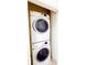 Efficient laundry area with stacked washer and dryer at 2520 Bella Vista Dr, Davenport, FL 33897